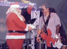 1996-12-23 Santa giving Jorma a birthday cake